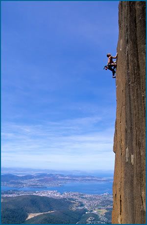 Simon Monks climbing “After Midnight”, grade 24 (F7a) at Organ Pipes Crag in Tasmania