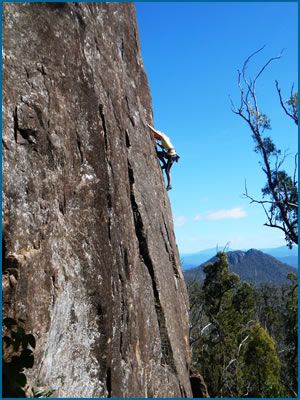 Jemimah Narkowicz climbing “Leap of Faith”, grade 19 (F6a+) at South Sister Crag in Tasmania