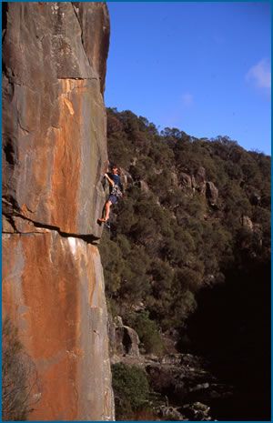 Gerry Narkowicz climbing “The Sting”, grade 23 (F6c) at South Esk crag in Tasmania