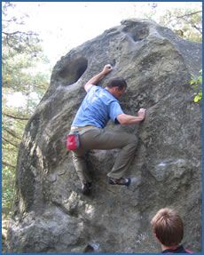 Ian Wyatt bouldering at Canche in the Trois Pignons area of Fontainebleau