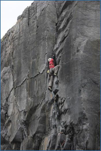 An unknown climber on Ground Control (VS 4c) at Ailladie crag, Ireland