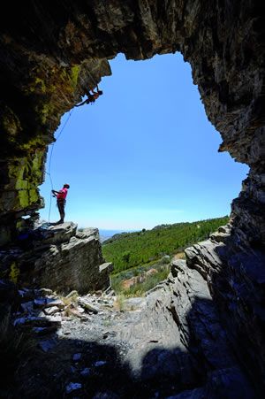 An unknown climber tackling the impressive arch at Serra de Passo