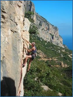 Robert leading Menhir (F7a) at Villaggia Gallica crag in Baunei