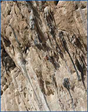 An unknown climber on Lourdes (F8a) at the Makinodromo crag at El Chorro