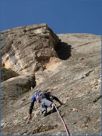 An unknown climber starting the classic route of Sam Bellua, F6b at Estrets crag in the Els Ports Natural Park