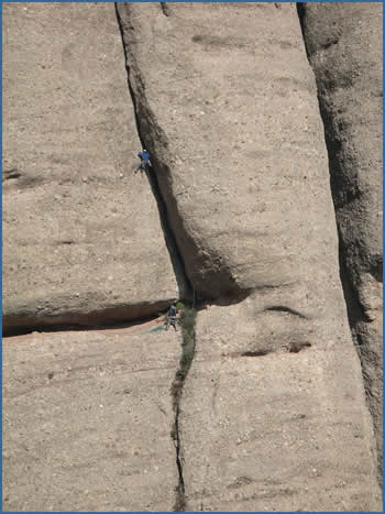 Climbers on Haus-Estrems, pitch 2 (F6a) at La Momia crag